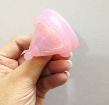 A collection of menstrual cups of various sizes and shapes, highlighting the discomfort associated with a one-size-fits-all approach. Choosing the right menstrual cup size and body type is important for a comfortable and effective fit.